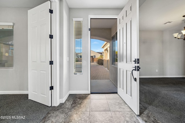 8695 W Cadwell Way, Marana, AZ 85653 - doorway with baseboards, carpet, and a chandelier