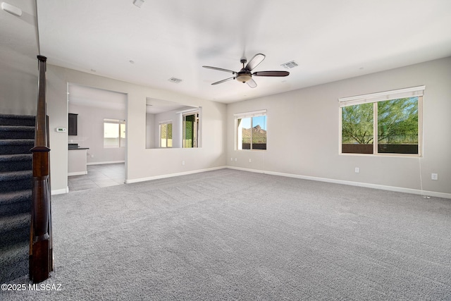 8695 W Cadwell Way, Marana, AZ 85653 - carpeted spare room with stairway, ceiling fan, and baseboards