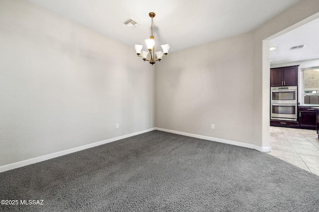 8695 W Cadwell Way, Marana, AZ 85653 - unfurnished room featuring a chandelier, light colored carpet, baseboards, and light tile patterned floors