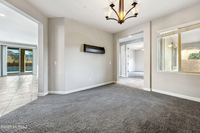 8695 W Cadwell Way, Marana, AZ 85653 - carpeted spare room featuring a chandelier and baseboards