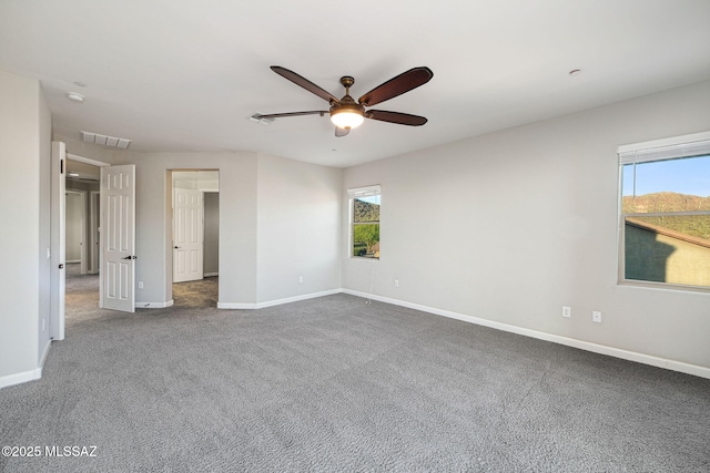 8695 W Cadwell Way, Marana, AZ 85653 - unfurnished bedroom with carpet, baseboards, and a ceiling fan