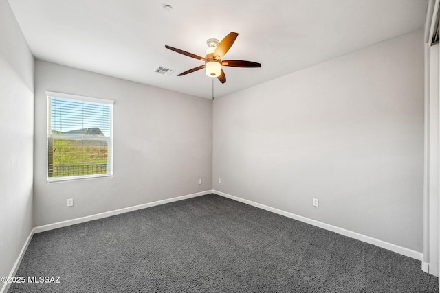 8695 W Cadwell Way, Marana, AZ 85653 - empty room featuring ceiling fan, baseboards, and dark colored carpet