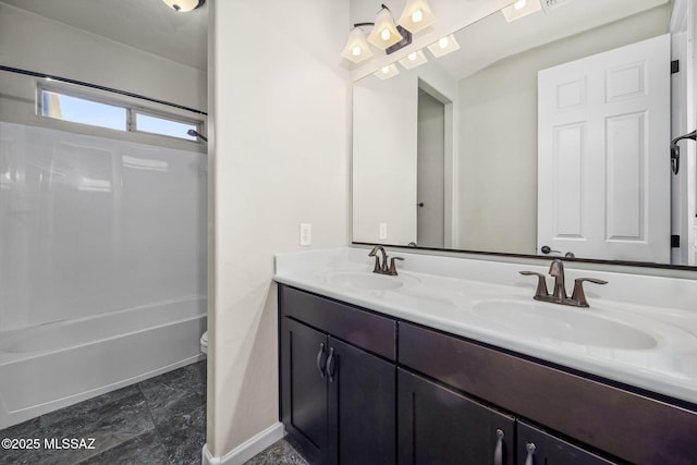 8695 W Cadwell Way, Marana, AZ 85653 - bathroom featuring double vanity, baseboards, tub / shower combination, toilet, and marble finish flooring