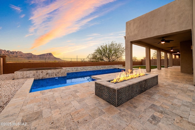 8695 W Cadwell Way, Marana, AZ 85653 - view of swimming pool with an outdoor fire pit, a patio area, a fenced backyard, and a ceiling fan