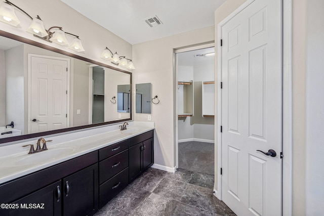 8695 W Cadwell Way, Marana, AZ 85653 - full bathroom featuring double vanity and baseboards