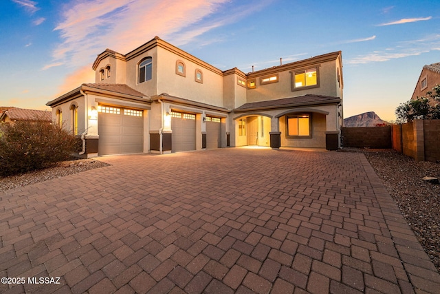 8695 W Cadwell Way, Marana, AZ 85653 - view of front of property with stucco siding, fence, decorative driveway, and an attached garage