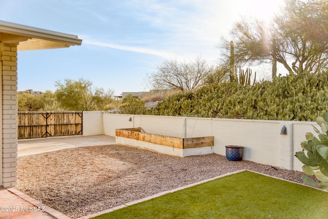 view of yard featuring a patio and fence