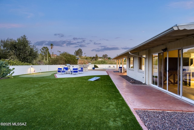 view of yard featuring a patio, a fenced in pool, and a fenced backyard