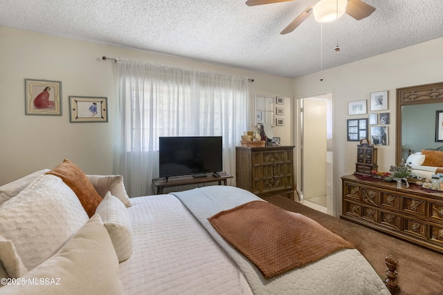 575 N Robles Rd, Oracle, AZ 85623 - carpeted bedroom featuring a textured ceiling and ceiling fan