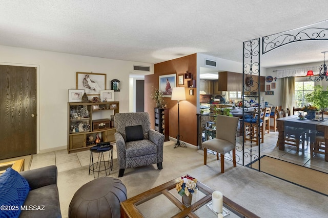 575 N Robles Rd, Oracle, AZ 85623 - living area featuring a textured ceiling, carpet, and baseboards