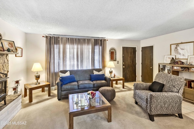 575 N Robles Rd, Oracle, AZ 85623 - living area with light colored carpet, a textured ceiling, and a fireplace