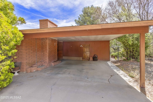 575 N Robles Rd, Oracle, AZ 85623 - view of side of property with a chimney, brick siding, and an attached carport