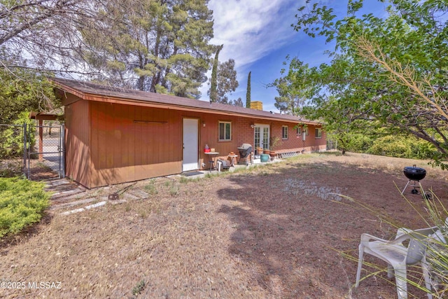 575 N Robles Rd, Oracle, AZ 85623 - back of property featuring a chimney, french doors, and fence