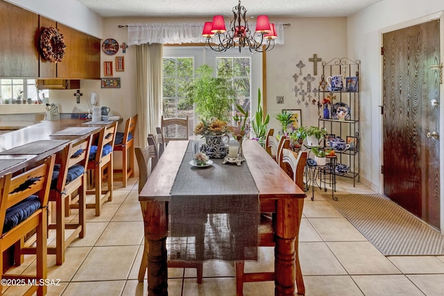 575 N Robles Rd, Oracle, AZ 85623 - dining area with light tile patterned flooring, a chandelier, and plenty of natural light