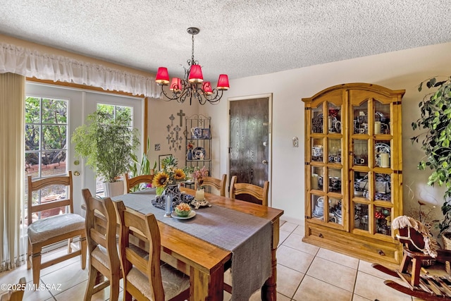 575 N Robles Rd, Oracle, AZ 85623 - dining room featuring light tile patterned flooring, a chandelier, and a textured ceiling