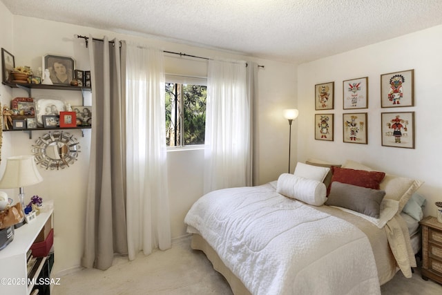 575 N Robles Rd, Oracle, AZ 85623 - bedroom featuring a textured ceiling, light colored carpet, and baseboards