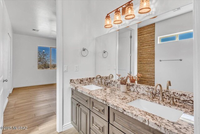 135 W Hawk Way, Amado, AZ 85645 - kitchen with freestanding refrigerator, wall chimney range hood, beamed ceiling, and black oven