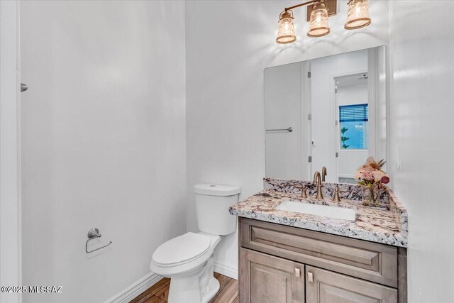 135 W Hawk Way, Amado, AZ 85645 - bathroom with wood finished floors, visible vents, a sink, and double vanity