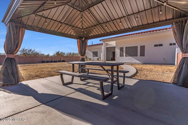 135 W Hawk Way, Amado, AZ 85645 - bathroom featuring a sink, double vanity, baseboards, and wood finished floors