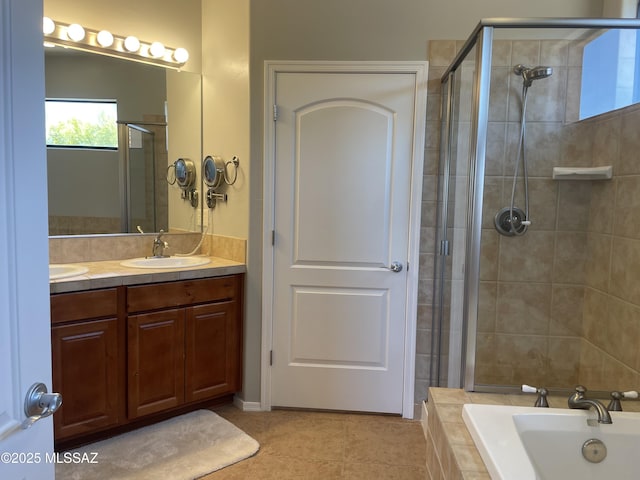 9454 E Lanterra Ct, Tucson, AZ 85710 - full bath with a relaxing tiled tub, a sink, a tile shower, tile patterned floors, and double vanity