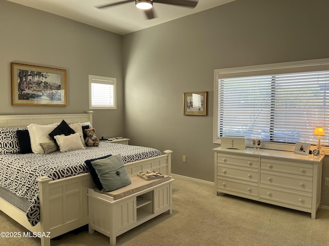 9454 E Lanterra Ct, Tucson, AZ 85710 - bedroom with light carpet, baseboards, and ceiling fan