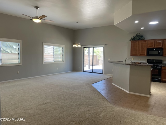 9454 E Lanterra Ct, Tucson, AZ 85710 - kitchen featuring a sink, open floor plan, baseboards, black appliances, and light colored carpet