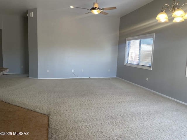 9454 E Lanterra Ct, Tucson, AZ 85710 - unfurnished room featuring baseboards, carpet, and ceiling fan with notable chandelier
