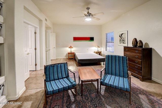 bedroom with baseboards and a ceiling fan