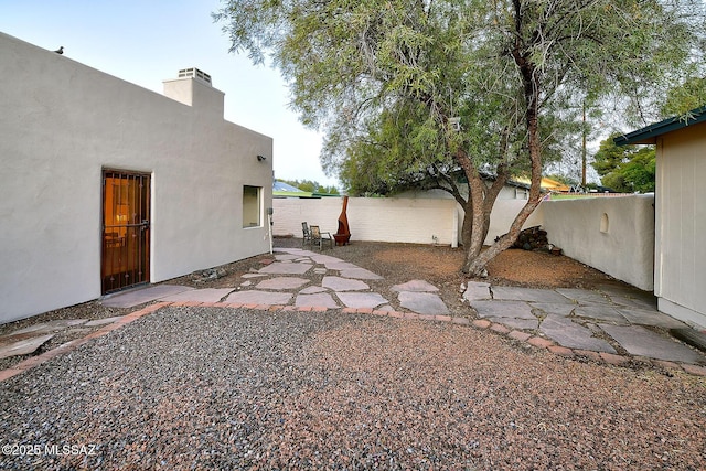 view of yard with a patio and fence