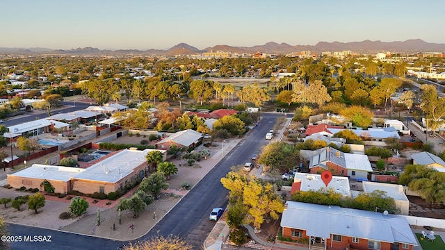 aerial view at dusk with a residential view and a mountain view