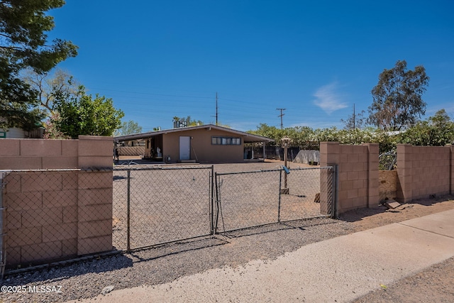 2220 E 35th St, Tucson, AZ 85713 - view of front of house featuring a gate, fence, a carport, and stucco siding