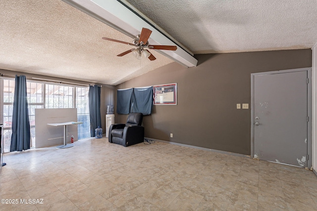 2220 E 35th St, Tucson, AZ 85713 - unfurnished living room with a textured ceiling, a ceiling fan, and baseboards