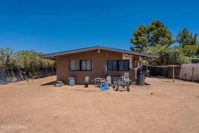 2220 E 35th St, Tucson, AZ 85713 - back of property with fence and stucco siding