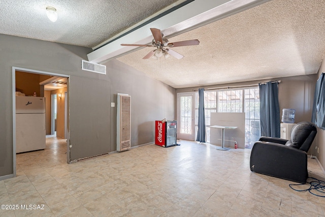 2220 E 35th St, Tucson, AZ 85713 - living area featuring a textured ceiling, a heating unit, and a ceiling fan
