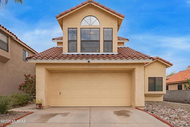 4755 W Lessing Ln, Tucson, AZ 85742 - mediterranean / spanish-style house with a tiled roof, concrete driveway, and stucco siding