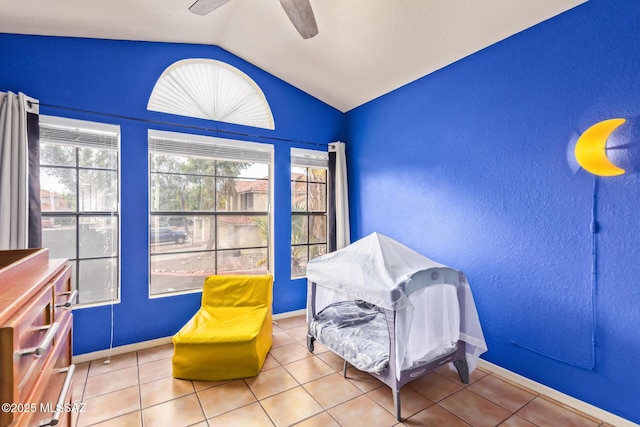 4755 W Lessing Ln, Tucson, AZ 85742 - living area featuring vaulted ceiling, a textured wall, ceiling fan, baseboards, and tile patterned flooring