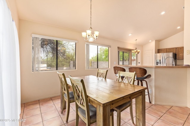 4755 W Lessing Ln, Tucson, AZ 85742 - dining area featuring a chandelier, recessed lighting, vaulted ceiling, light tile patterned flooring, and baseboards