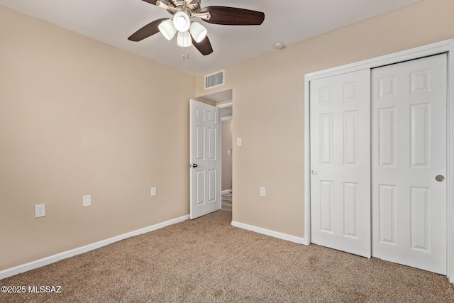 1239 N Beverly Ave, Tucson, AZ 85712 - unfurnished bedroom featuring carpet floors, a closet, baseboards, and ceiling fan