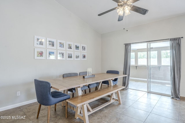 dining room with a ceiling fan, baseboards, and light tile patterned flooring