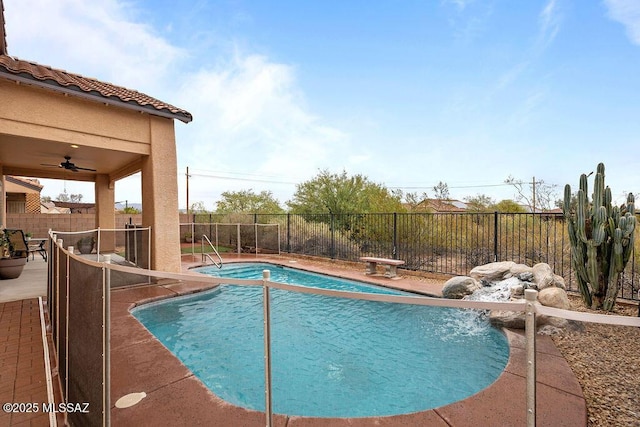 view of pool featuring a fenced backyard, ceiling fan, and a patio