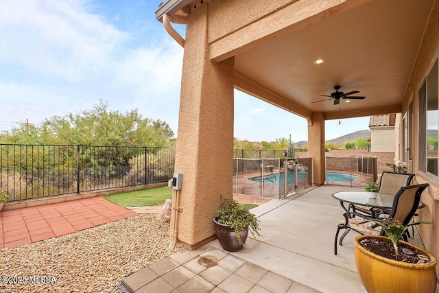 view of patio featuring ceiling fan and a fenced backyard