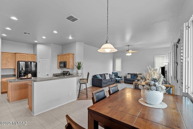 dining area featuring ceiling fan, recessed lighting, and light tile patterned floors