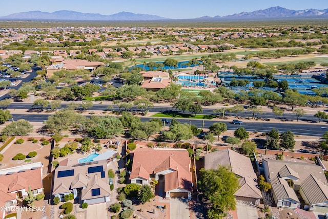 1328 N Mahogany Gulch Ln, Green Valley, AZ 85614 - aerial perspective of suburban area with a mountainous background