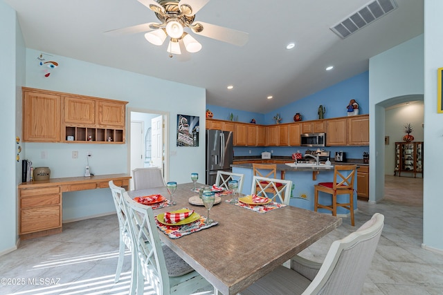 1328 N Mahogany Gulch Ln, Green Valley, AZ 85614 - dining space featuring arched walkways, a ceiling fan, light tile patterned floors, recessed lighting, and high vaulted ceiling