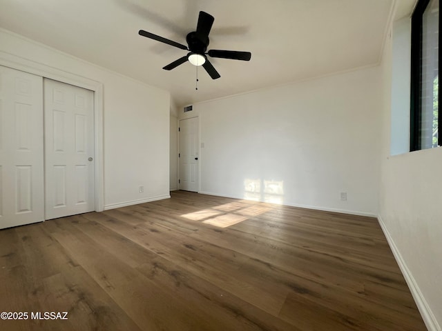 2838 E Beverly Dr, Tucson, AZ 85716 - unfurnished bedroom with wood finished floors, baseboards, ornamental molding, a closet, and a ceiling fan