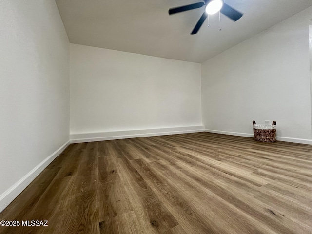 2838 E Beverly Dr, Tucson, AZ 85716 - empty room featuring wood finished floors, baseboards, a ceiling fan, and vaulted ceiling