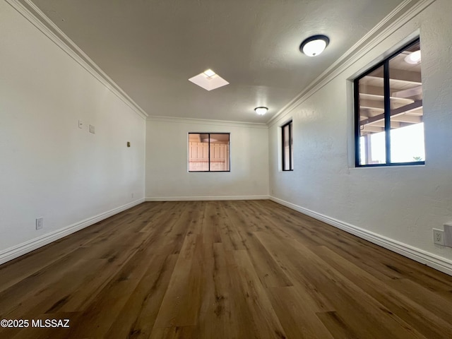 2838 E Beverly Dr, Tucson, AZ 85716 - empty room featuring ornamental molding, wood finished floors, and baseboards