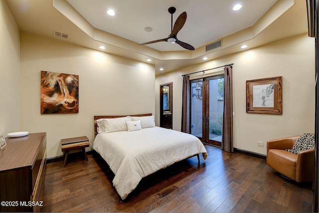 6015 N Camino Preciado, Tucson, AZ 85718 - bedroom with access to outside, dark wood-style flooring, baseboards, recessed lighting, and a raised ceiling