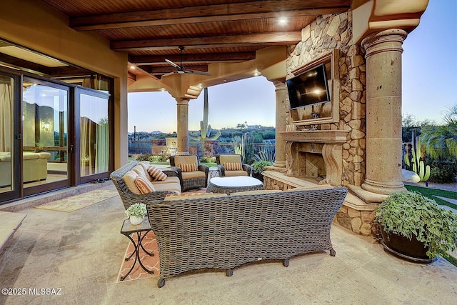 6015 N Camino Preciado, Tucson, AZ 85718 - view of patio / terrace with an outdoor stone fireplace and ceiling fan
