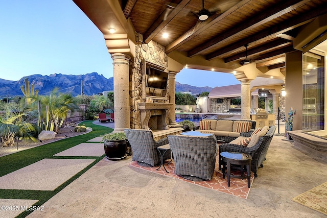 6015 N Camino Preciado, Tucson, AZ 85718 - view of patio with an outdoor living space with a fireplace, a fenced backyard, area for grilling, ceiling fan, and grilling area